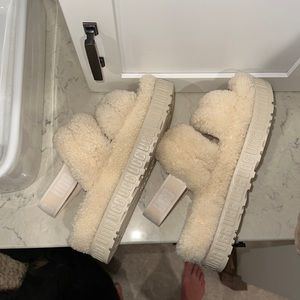 Brand New Ugg Slides. Never worn other than trying on. perfect condition.